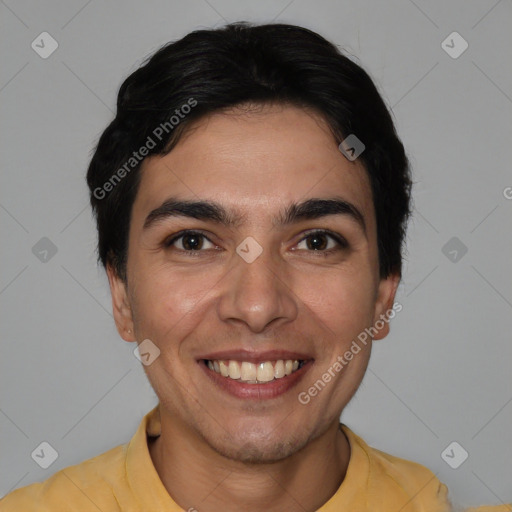 Joyful white young-adult male with short  black hair and brown eyes