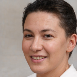 Joyful white adult female with short  brown hair and brown eyes