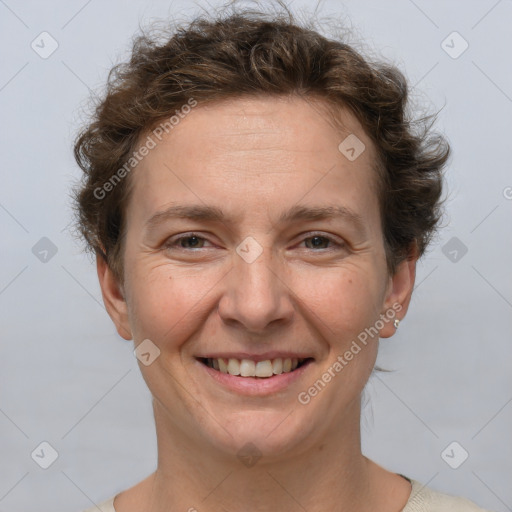 Joyful white adult female with short  brown hair and brown eyes