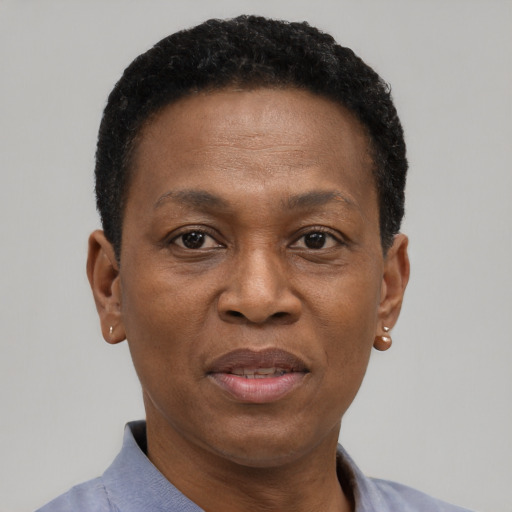 Joyful black adult female with short  brown hair and brown eyes