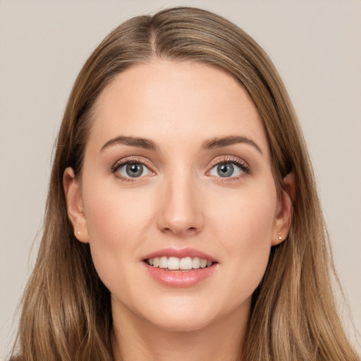 Joyful white young-adult female with long  brown hair and grey eyes