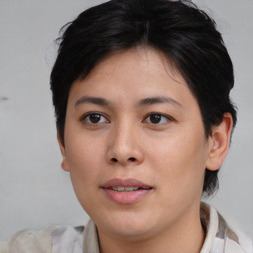 Joyful asian young-adult female with medium  brown hair and brown eyes