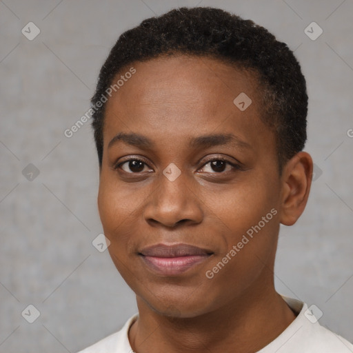 Joyful black young-adult female with short  black hair and brown eyes