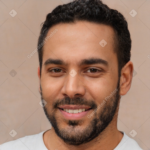 Joyful white young-adult male with short  black hair and brown eyes