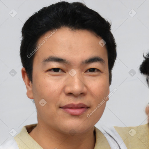 Joyful asian young-adult male with short  black hair and brown eyes