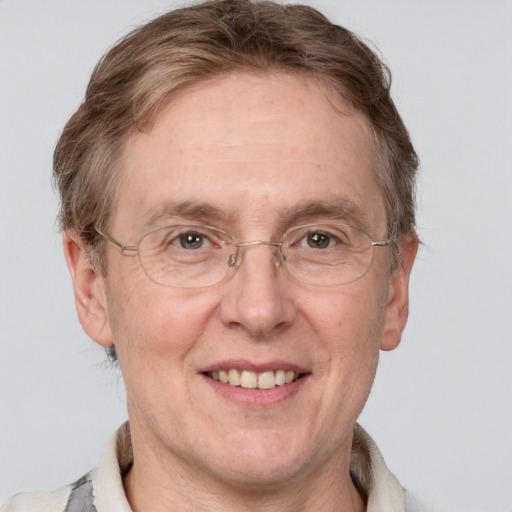 Joyful white middle-aged male with short  brown hair and grey eyes