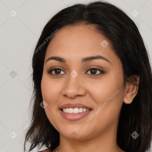 Joyful latino young-adult female with long  brown hair and brown eyes