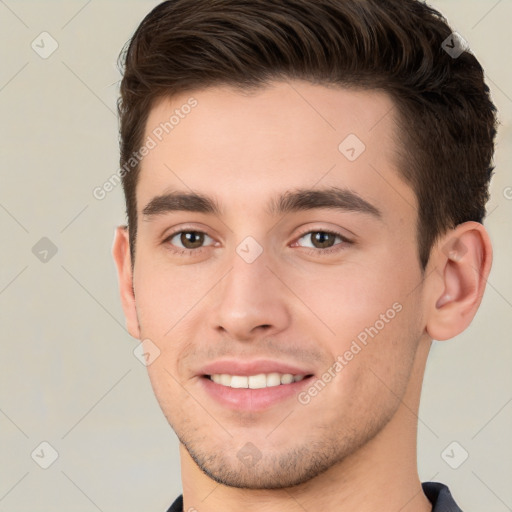 Joyful white young-adult male with short  brown hair and brown eyes