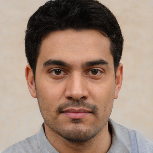 Neutral white young-adult male with short  black hair and brown eyes