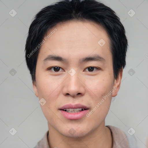 Joyful asian young-adult male with short  brown hair and brown eyes