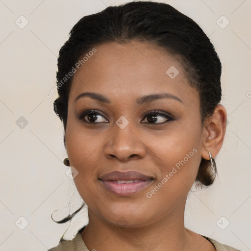 Joyful black young-adult female with short  black hair and brown eyes