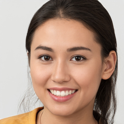 Joyful white young-adult female with long  brown hair and brown eyes