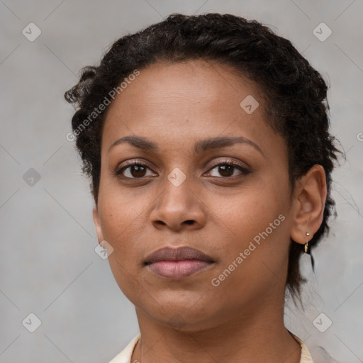 Neutral black young-adult female with short  brown hair and brown eyes