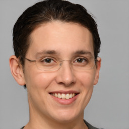 Joyful white adult male with short  brown hair and grey eyes