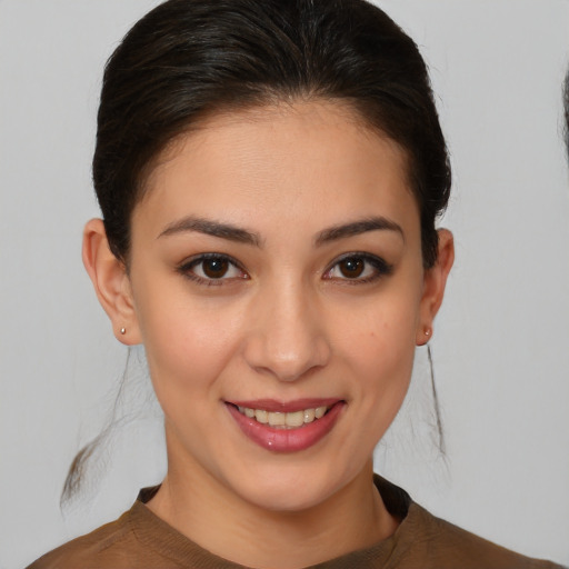 Joyful white young-adult female with medium  brown hair and brown eyes