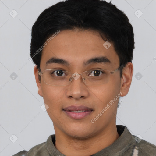 Joyful asian young-adult male with short  black hair and brown eyes