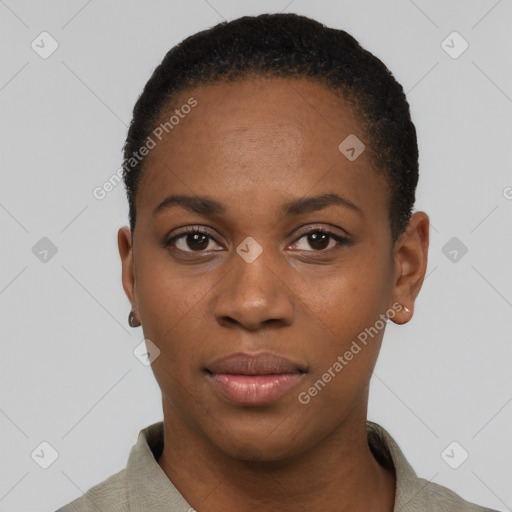 Joyful black young-adult female with short  black hair and brown eyes