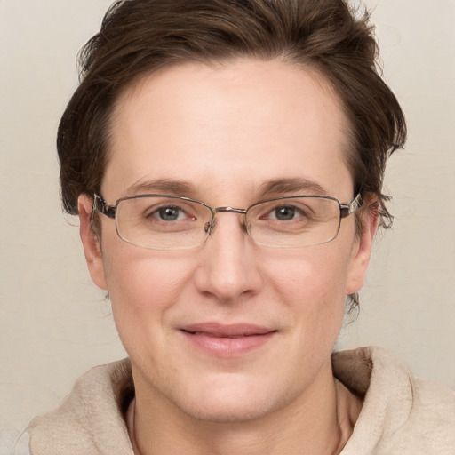 Joyful white adult female with short  brown hair and grey eyes