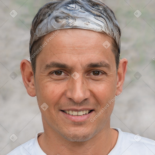 Joyful white adult male with short  brown hair and brown eyes