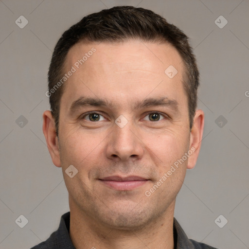 Joyful white adult male with short  brown hair and grey eyes