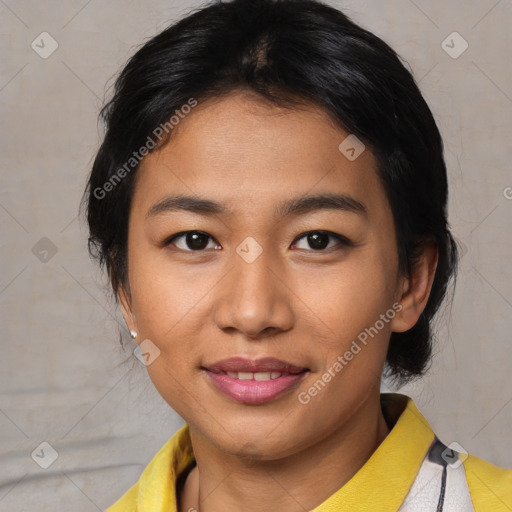 Joyful asian young-adult female with short  black hair and brown eyes