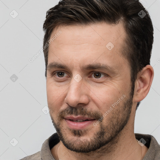 Joyful white adult male with short  brown hair and brown eyes