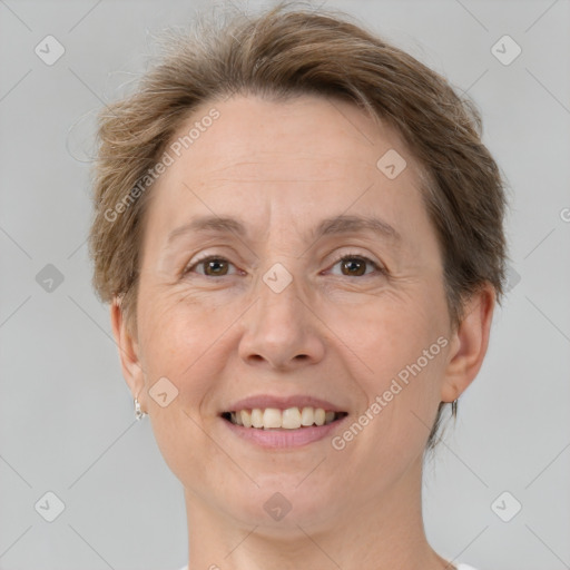 Joyful white adult female with short  brown hair and brown eyes