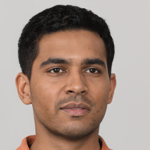 Neutral latino young-adult male with short  black hair and brown eyes