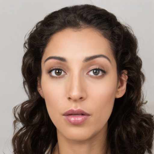 Neutral white young-adult female with long  brown hair and brown eyes