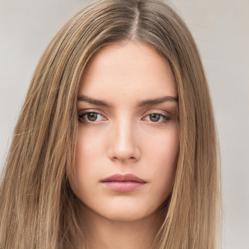 Neutral white young-adult female with long  brown hair and brown eyes