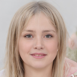 Joyful white young-adult female with medium  brown hair and green eyes