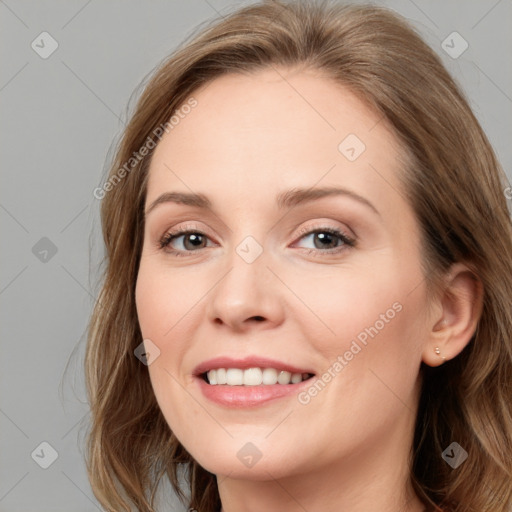 Joyful white young-adult female with long  brown hair and blue eyes