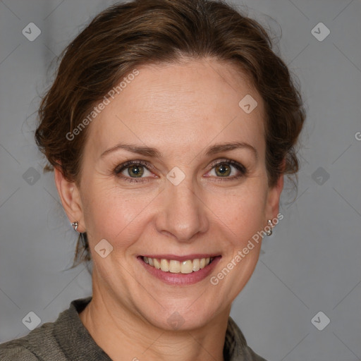 Joyful white adult female with medium  brown hair and grey eyes