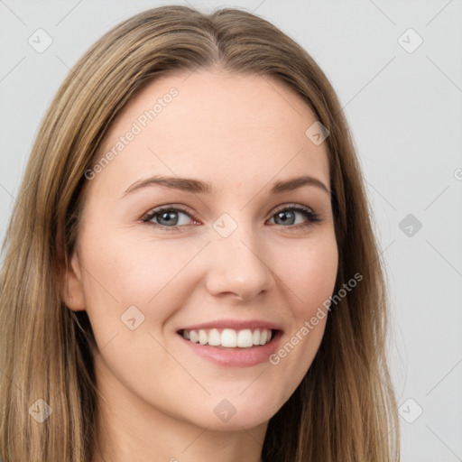 Joyful white young-adult female with long  brown hair and grey eyes