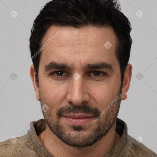 Joyful white young-adult male with short  black hair and brown eyes