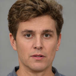 Neutral white adult male with short  brown hair and brown eyes