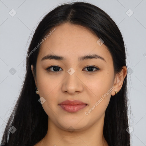 Joyful asian young-adult female with long  brown hair and brown eyes