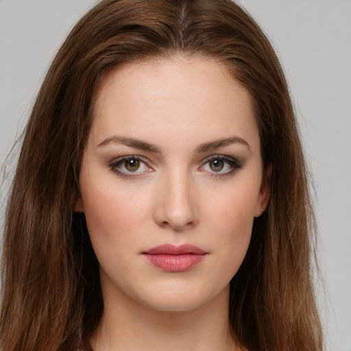 Neutral white young-adult female with long  brown hair and green eyes