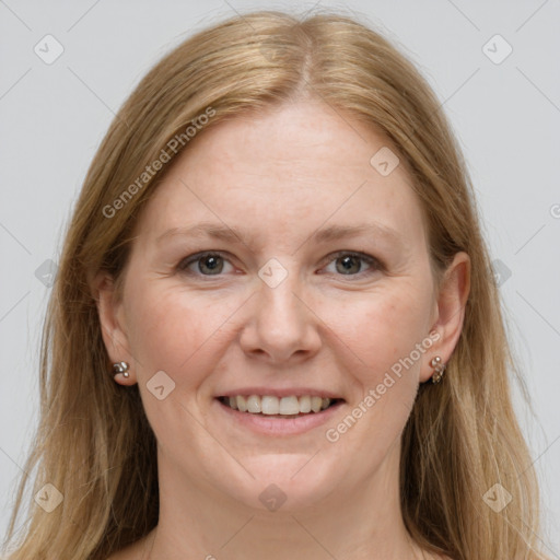 Joyful white adult female with long  brown hair and grey eyes