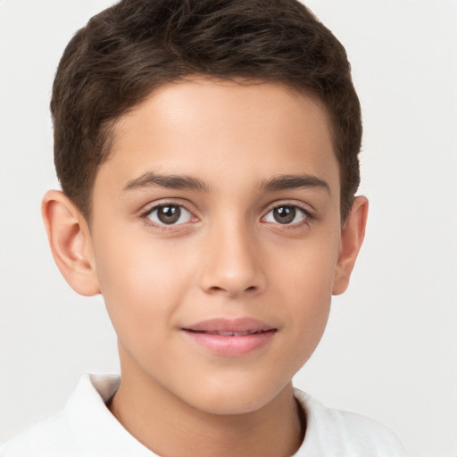 Joyful white child male with short  brown hair and brown eyes