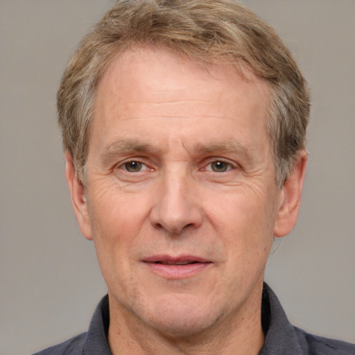 Joyful white middle-aged male with short  brown hair and grey eyes