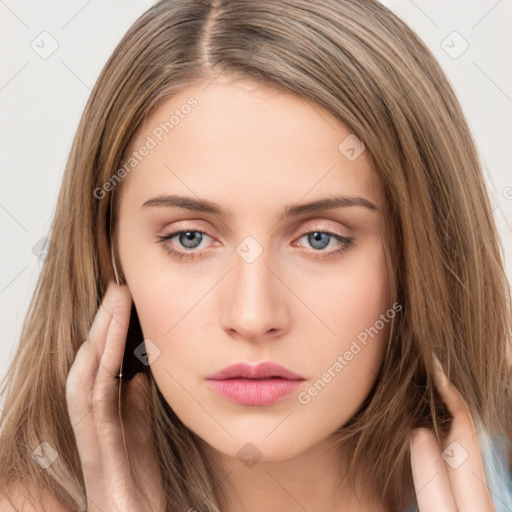 Neutral white young-adult female with long  brown hair and brown eyes