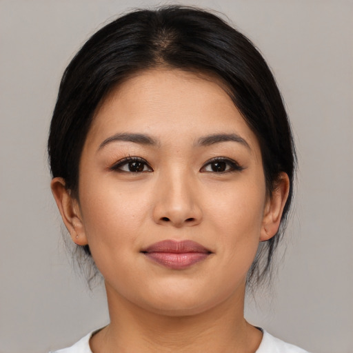 Joyful asian young-adult female with medium  brown hair and brown eyes