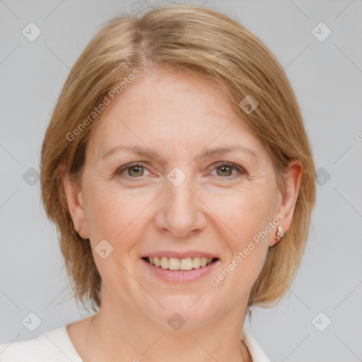 Joyful white adult female with medium  brown hair and grey eyes