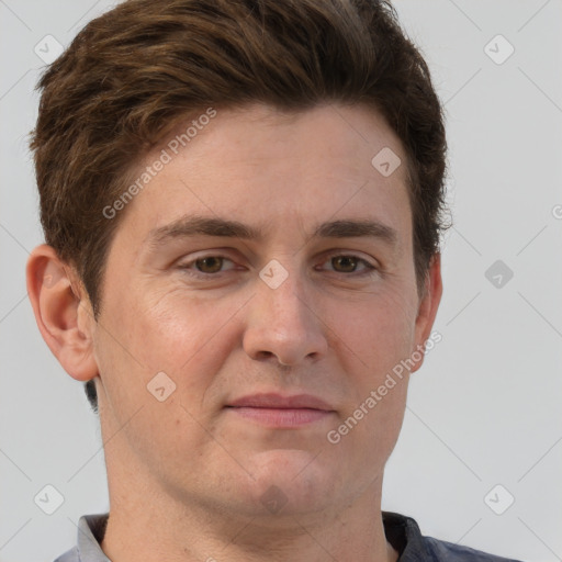 Joyful white adult male with short  brown hair and grey eyes