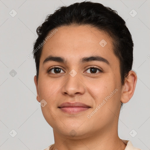 Joyful latino young-adult male with short  brown hair and brown eyes