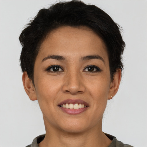 Joyful asian young-adult female with short  brown hair and brown eyes