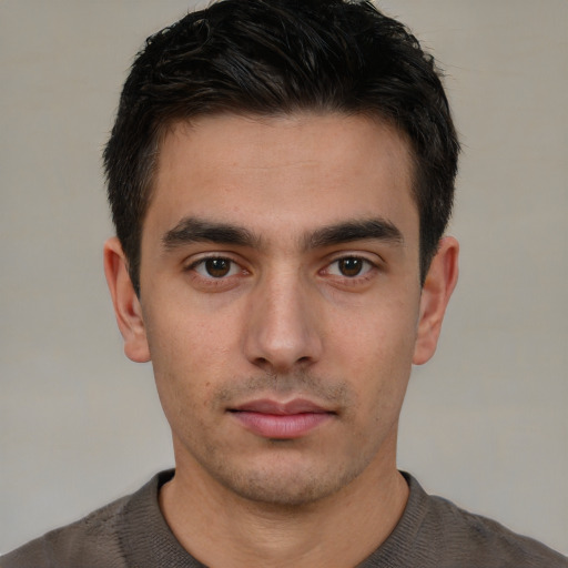 Neutral white young-adult male with short  brown hair and brown eyes