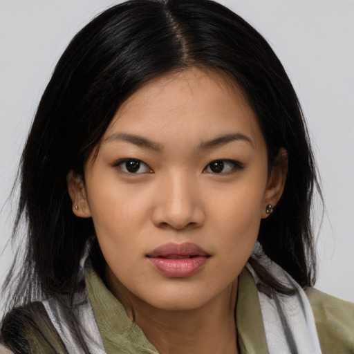 Joyful asian young-adult female with medium  black hair and brown eyes