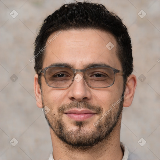 Joyful white adult male with short  black hair and brown eyes